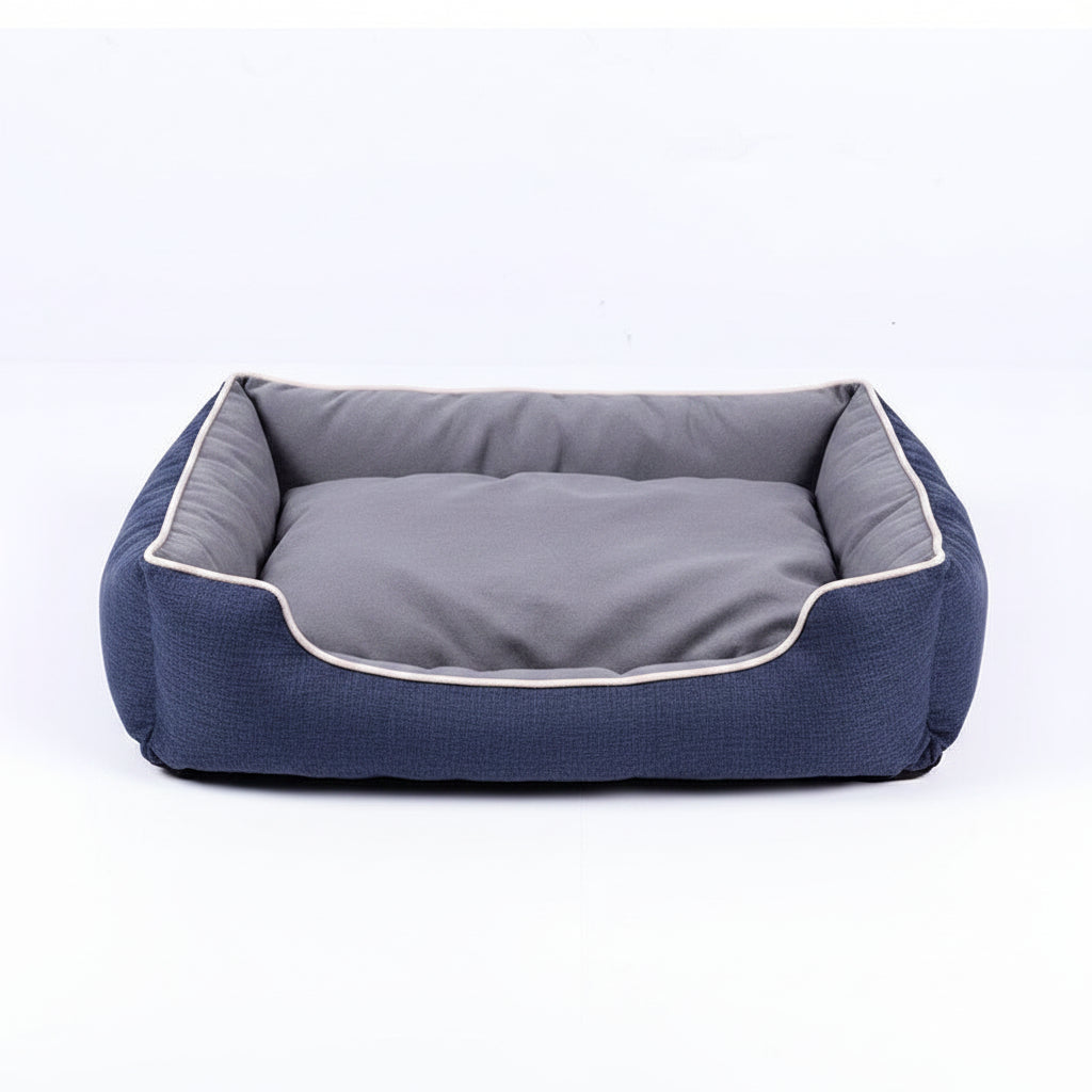 Dark blue pet bed with brown exterior on a white background