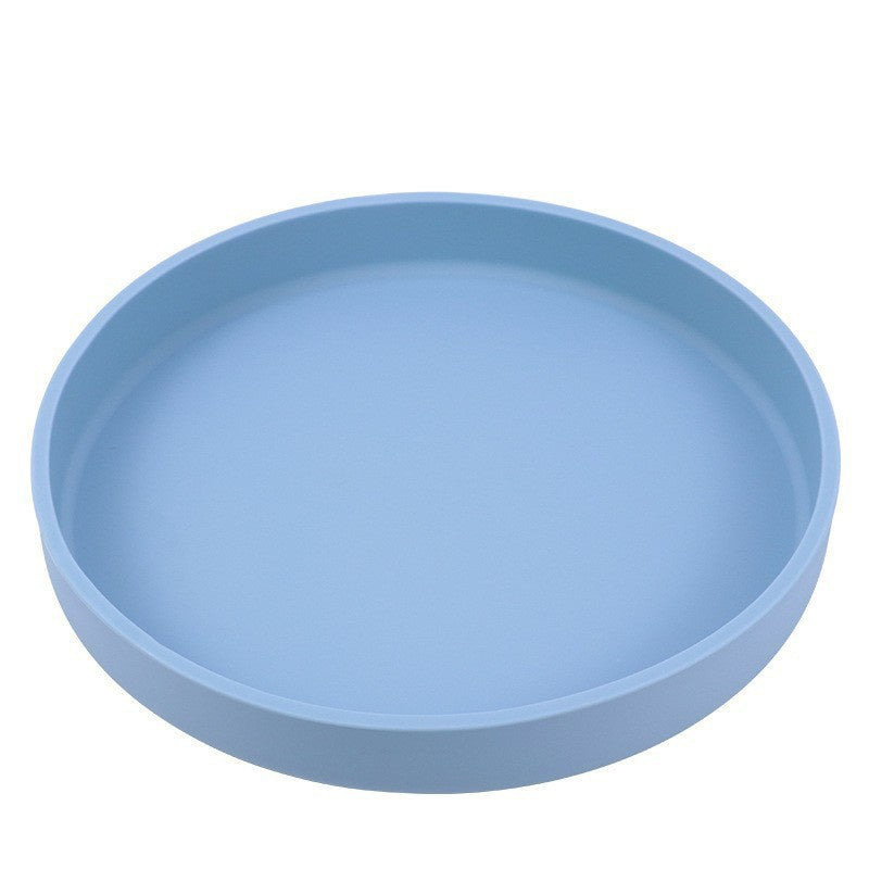 A light blue circular shallow tray or plate shown from a top-down angle on a plain white background.
