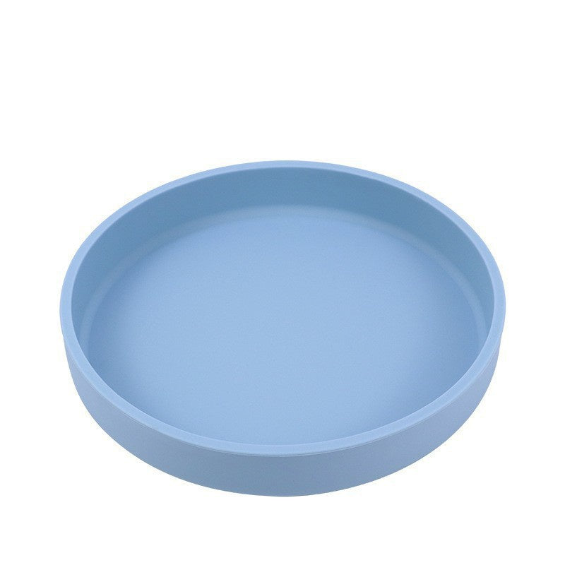 A light blue round shallow tray or plate shown from a top-down angle on a plain white background.