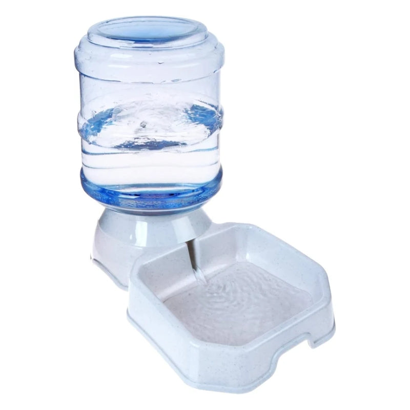 A pet water fountain with a clear plastic water bottle filled with water and a white plastic bowl below, shown on a plain white background.