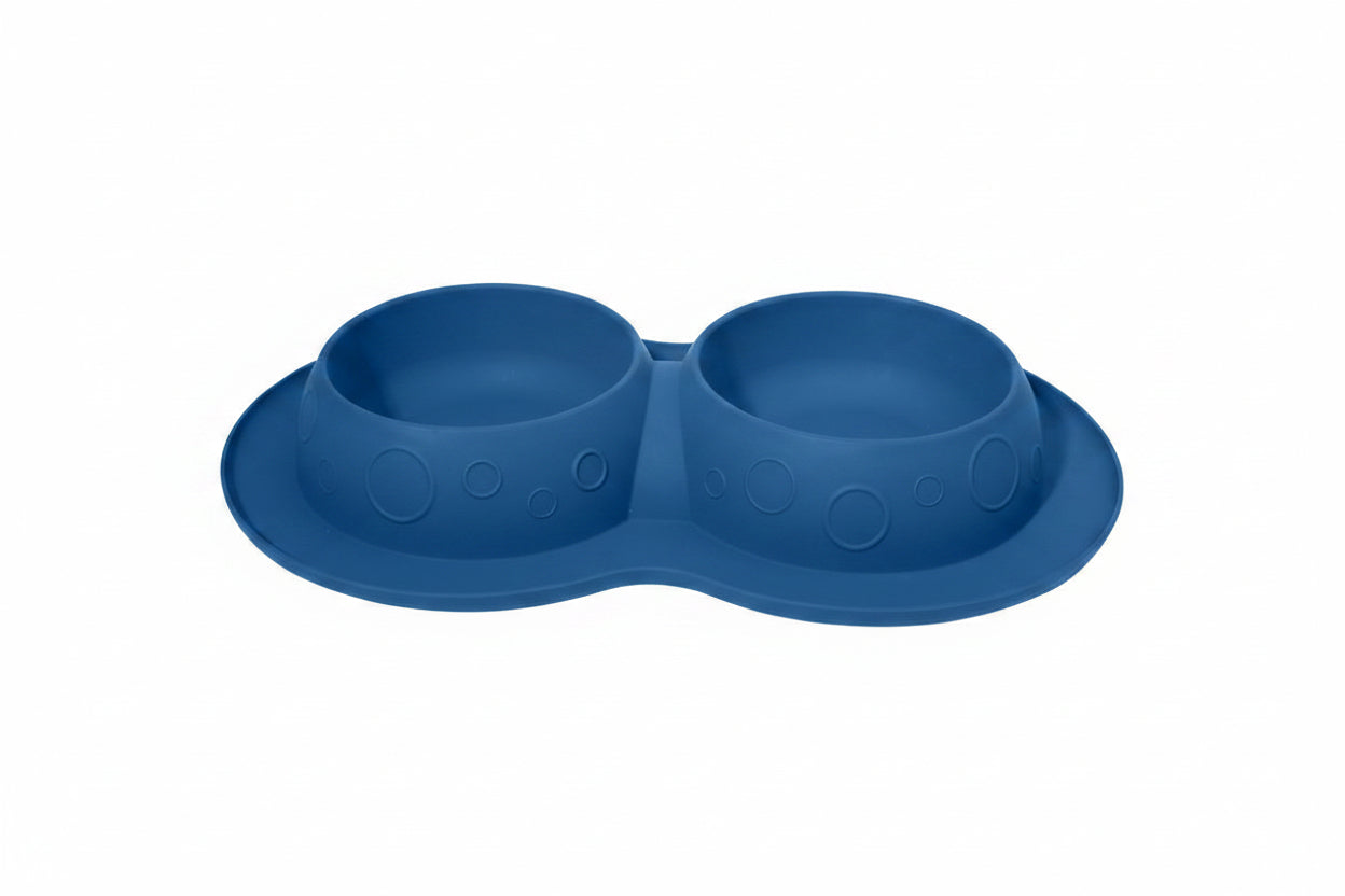 Blue silicone double-bowled feeder on a white background