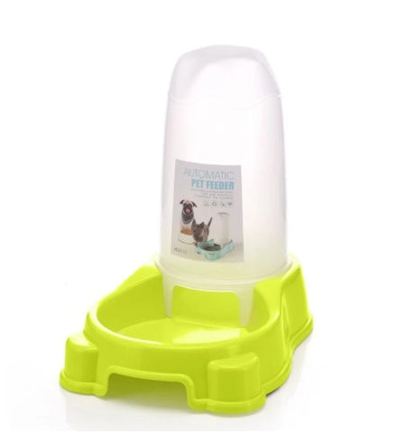 Green and clear automatic pet feeder on a white background