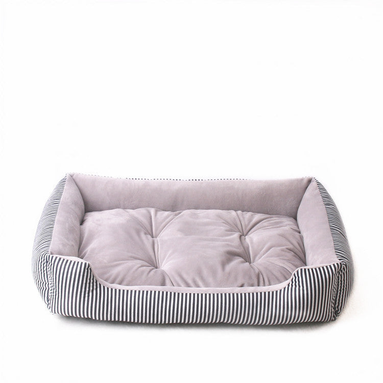Pet bed with striped exterior and tufted interior on a white background