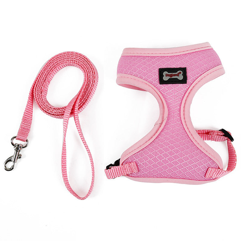Pink dog harness and leash set on a white background